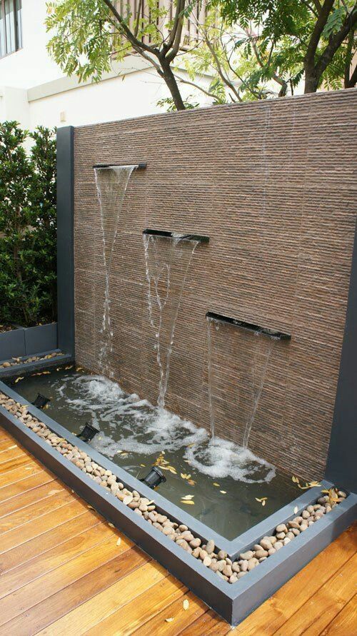 Waterfall Flowing Into A Water Feature Wall