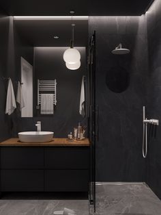 All Black Bathroom With White Accessories 